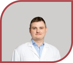 A man in a white coat.