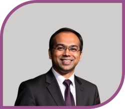 A man wearing a suit and tie.