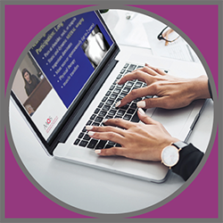 A person typing on a laptop.